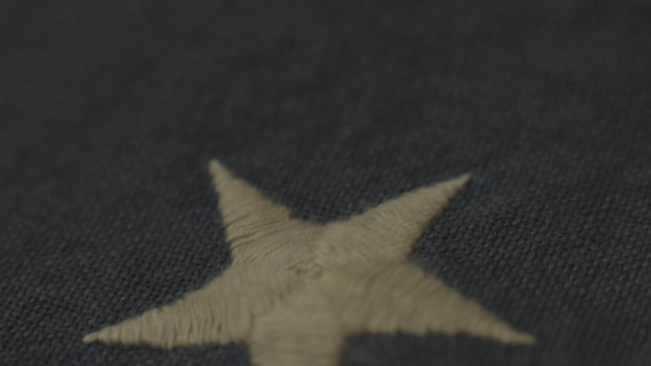 Detail of American flag with 13 stars of the revolution
