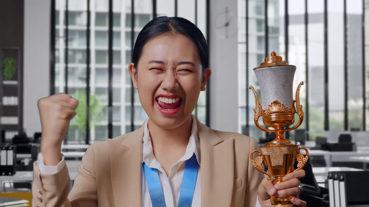 Woman Celebrating Achievement in Office