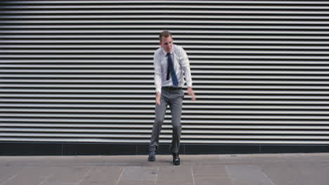 Contemporary-funky-caucasian-businessman-street-dancer-dancing-freestyle-in-the-city