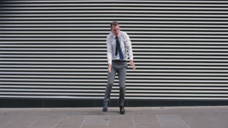 contemporary funky caucasian businessman street dancer dancing freestyle in the city