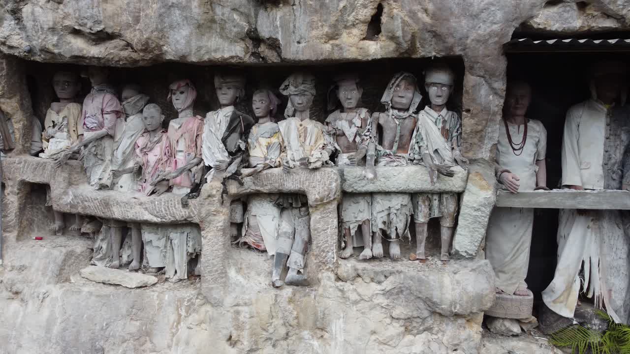 Tau Tau Effigies in Toraja Burial Cliff