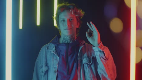 stylish young man with neon lights