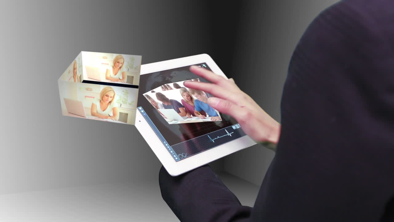 Woman using tablet to view holographic education videos