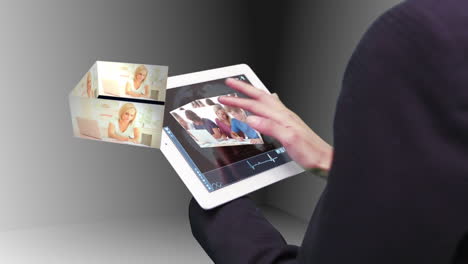 Woman-using-tablet-to-view-holographic-education-videos