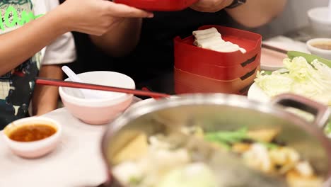 friends enjoying a hotpot meal together