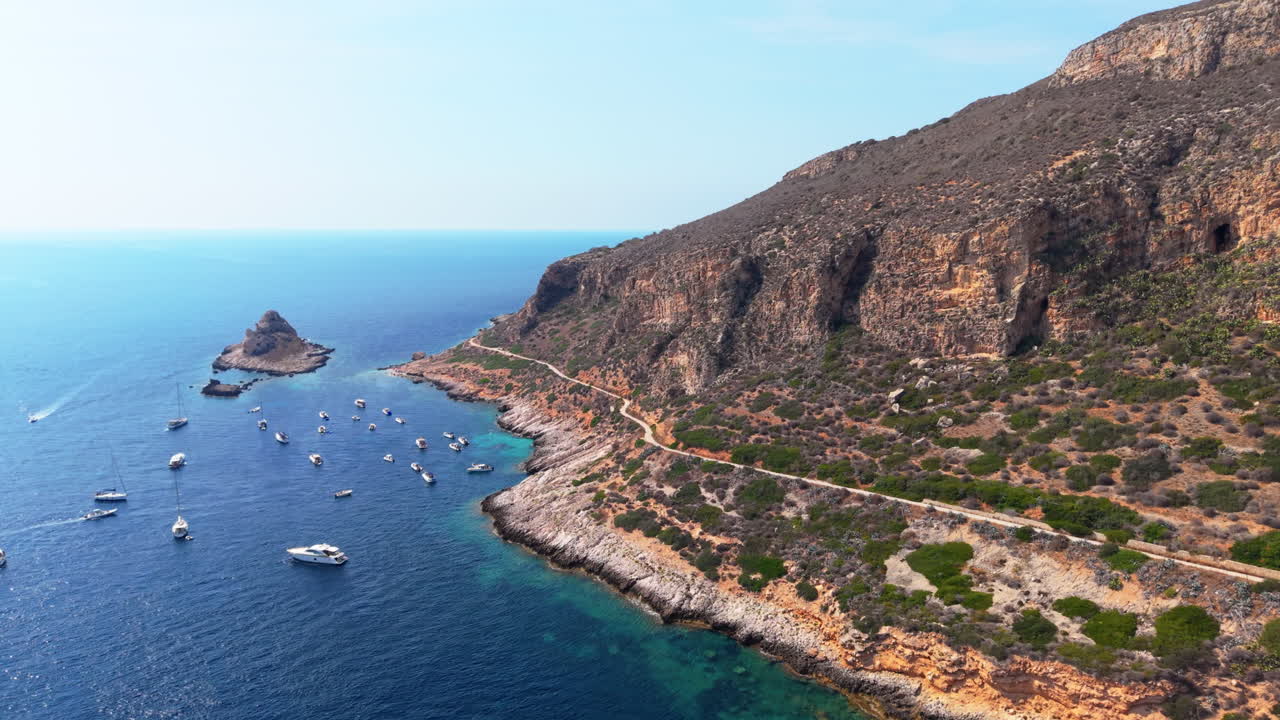 Coastal view with boats and a mountain