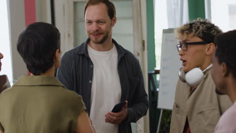 diverse group collaborating and discussing in an office meeting