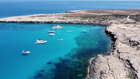 yachts and recreational boats anchored on cape greco, ayia napa, cyprus