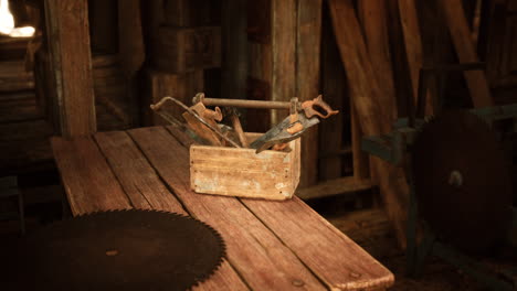 a wooden toolbox filled with vintage tools on a rustic workbench