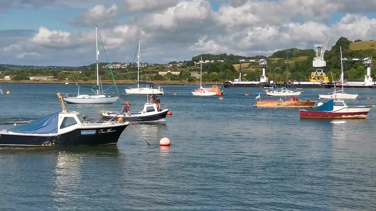 Small Powerboat Traveling Down the River Tamar near Saltash in Cornwall on a Summer's Day in England