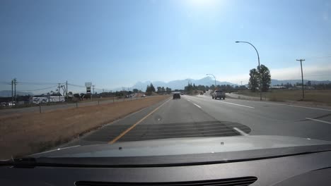 Time-Lapse-trough-Driving-Car's-Window,-Passenger-POV,-Sunny-Day