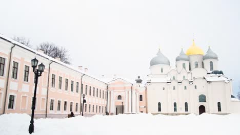 snowy winter scene of a russian cathedral and buildings