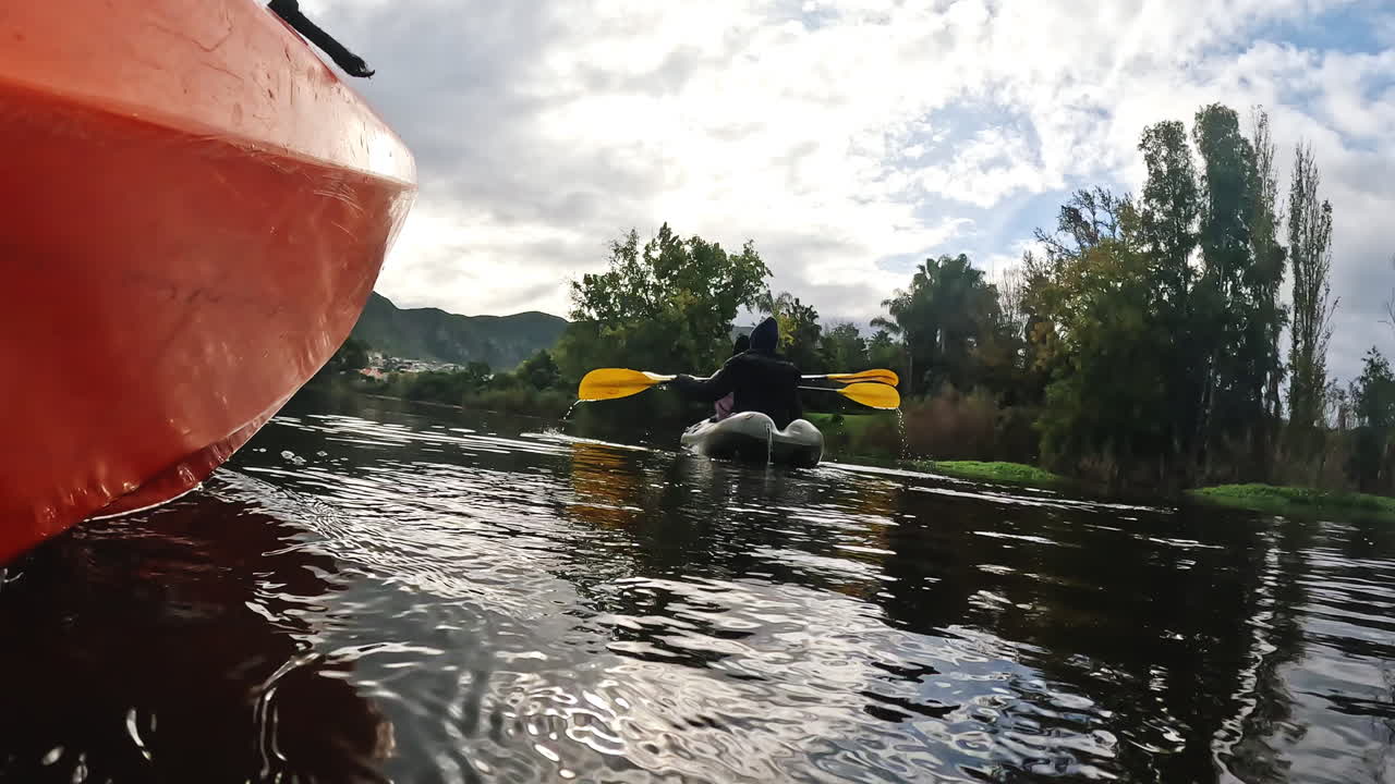 Kayaking, water sport and friends on a boat