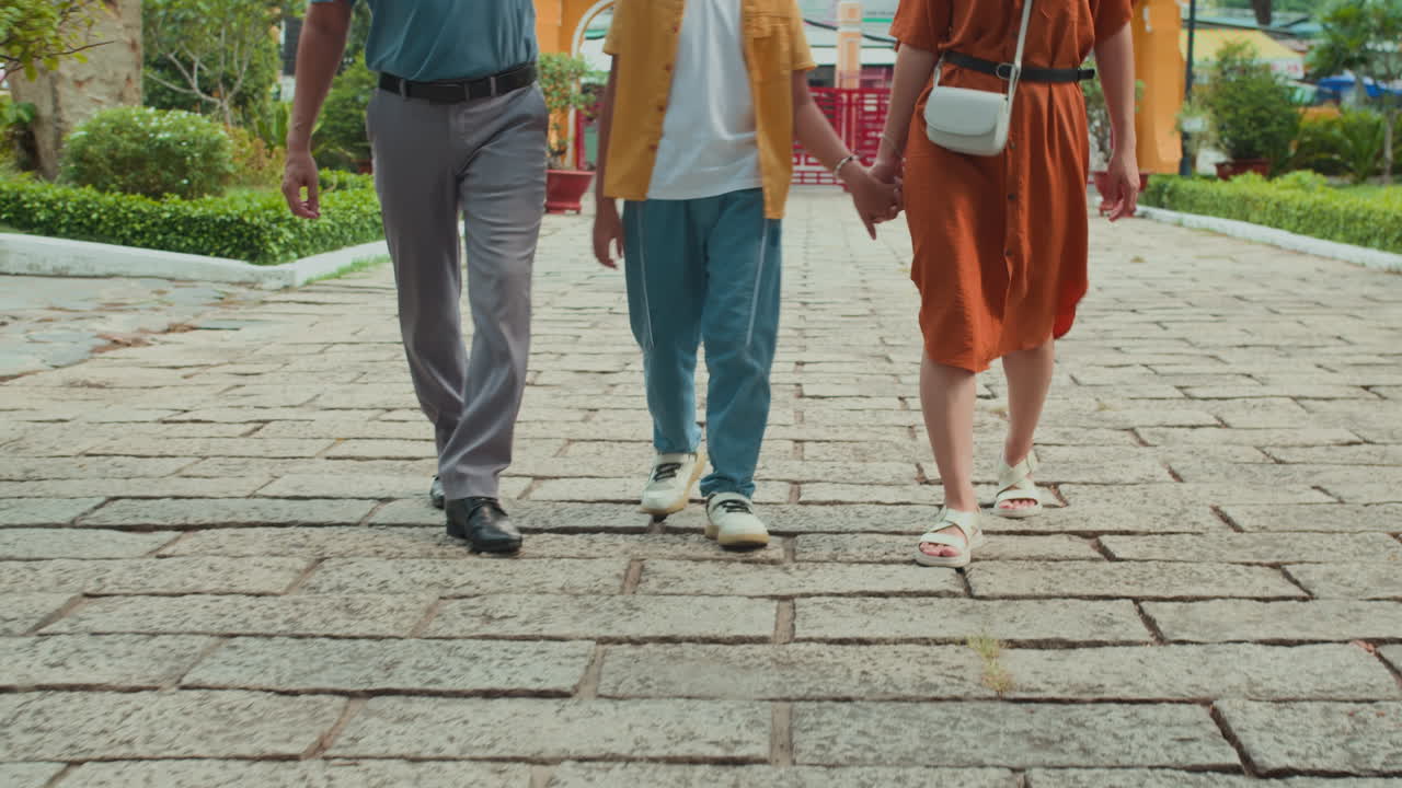 Son and Parents Having Visit to Ancient Temple