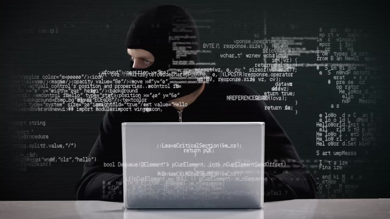 Burglar hacking into laptop