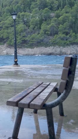 flooded pier with bench and lamp post