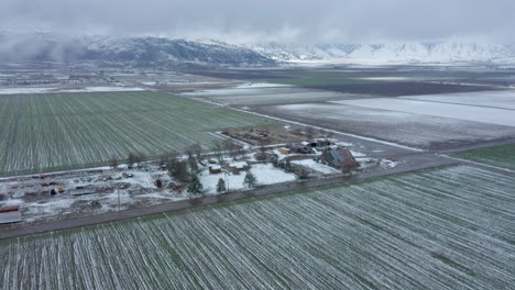 rising over a wintery, snowy farm in tehachapi, ca