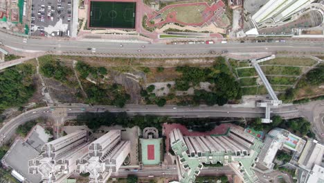 Downtown-Hong-Kong-city-skyscrapers-and-urban-traffic,-Aerial-view