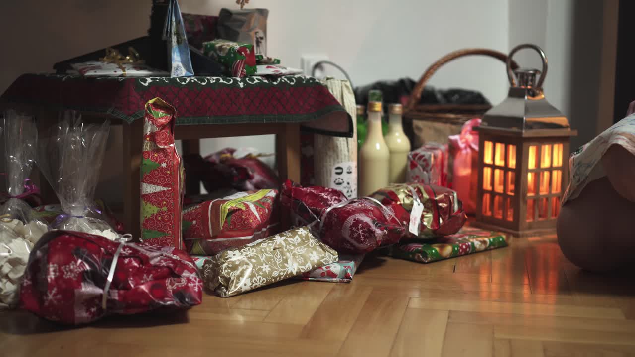 Girl taking Christmas gift under tree, lantern in background, middle shot view
