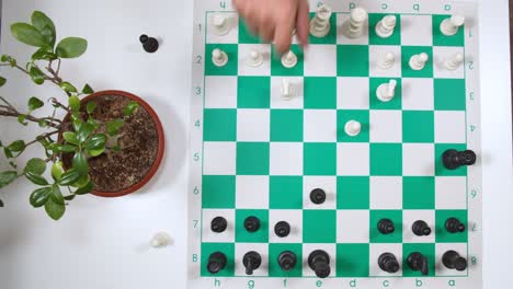 chess players move pawn and knight on chessboard