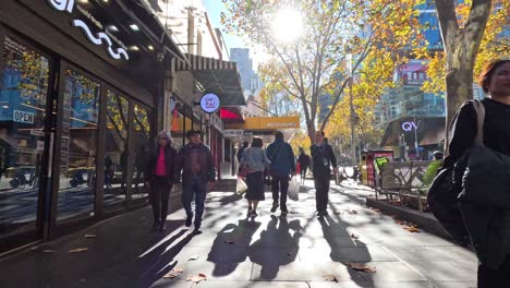 people walking in sunny melbourne city streets