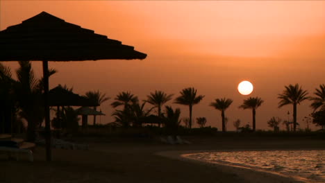 time lapse shot of sunset over desert resort hotel
