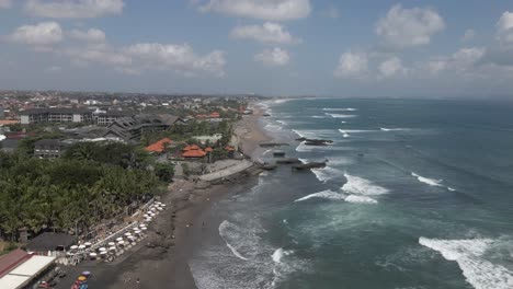 aerial flight over megada beach on south coast of bali, rock outcrops