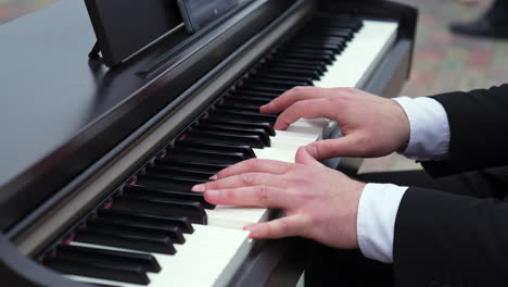 person playing a digital piano