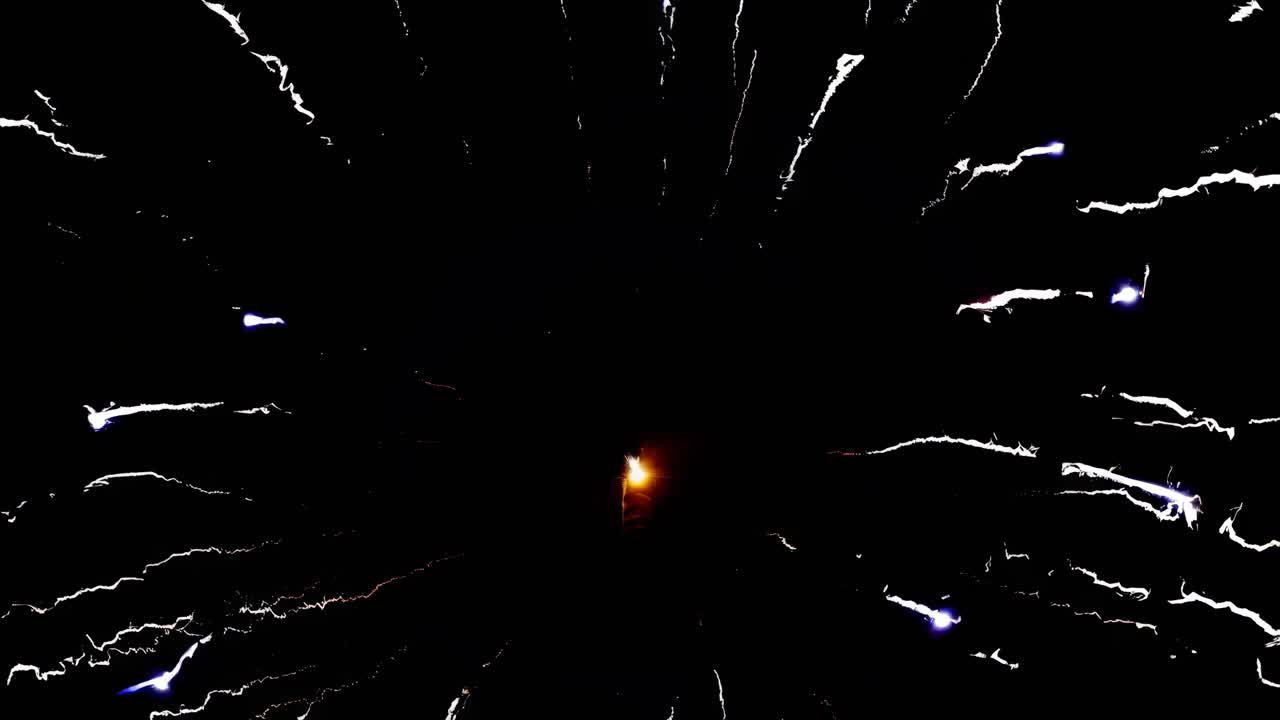 A dynamic video capturing fireworks from a low-angle perspective, showcasing vibrant streaks