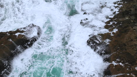 Waves-Crashing-in-the-ocean-near-some-rocks-closeup