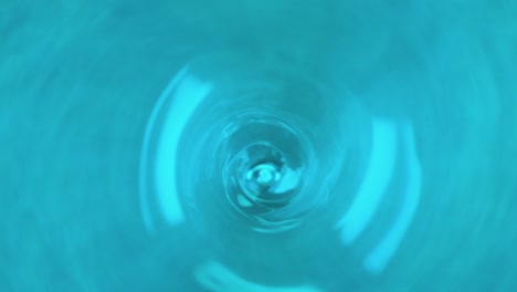 swirl in water with blue paint