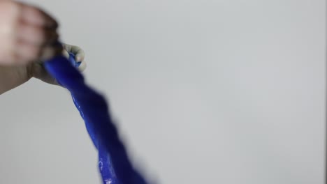 child having fun making slime. kid playing with hand made toy slime.