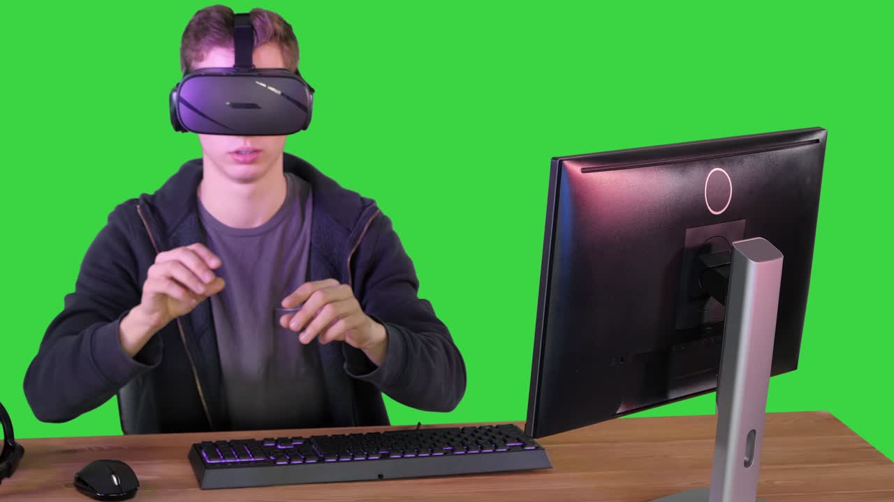 Gamer boy playing with VR headset on a Green Screen, Chroma Key