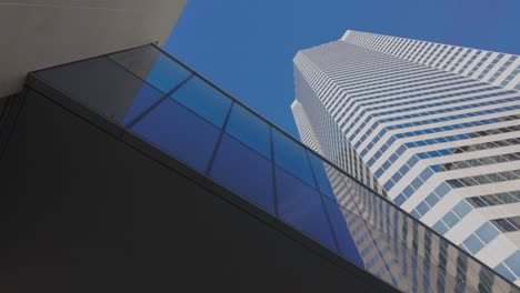 looking up at skyscrapers and building bridge in downtown houston