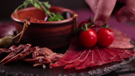 delicious charcuterie board with assorted meats and sides