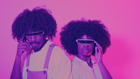 stylized retro-futuristic portrait of two people with afros and cyberpunk visors