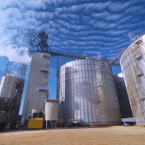 large grain bins. modern granary elevator. agribusiness
