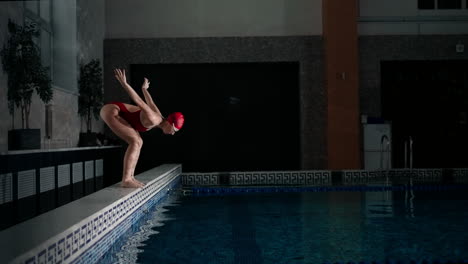 woman diving into swimming pool