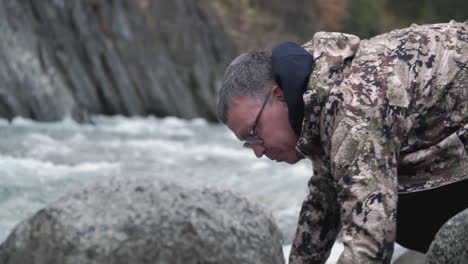 man fishing in a mountain river