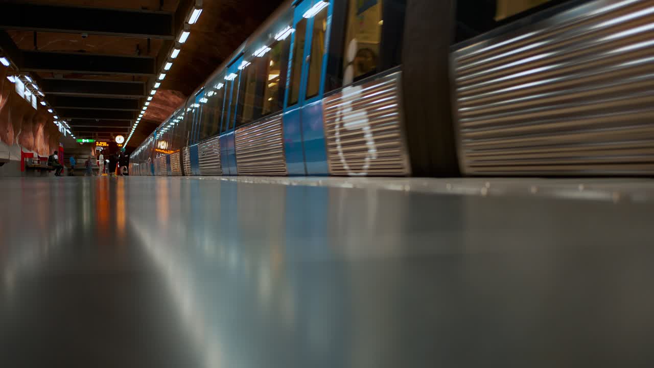 An underground train arriving at Radhuset station, Stockholm, Sweden. Subway metro architecture