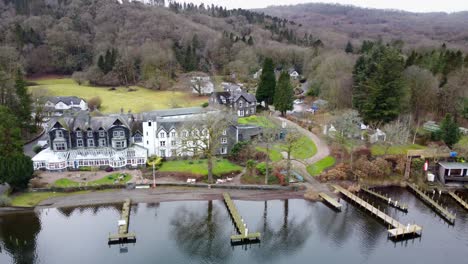 cinematic aerial footage of fell foot on lake windermere a lakeshore park with stunning views of the cumbrian mountains