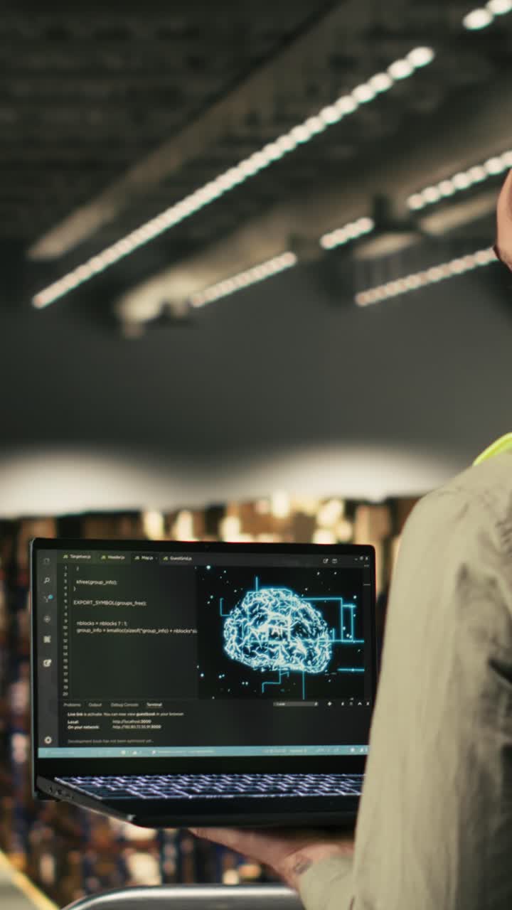 Vertical Video Male staff member, AI technology, logistics on laptop, high tech tools
