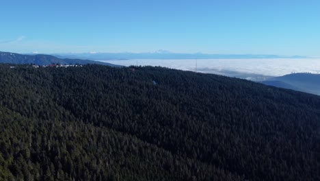 aerial view of the mountains of british columbia with mount baker in the distance