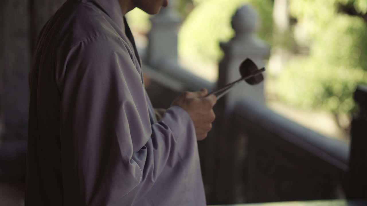 Buddhist Monk Performing Ceremony in a Temple