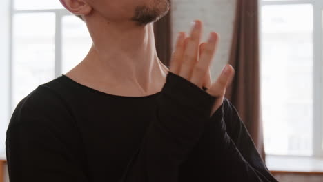 meditative hand gestures and gentle stretching exercises