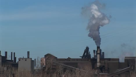 A Small Industrial Plant Spews Out Smoke