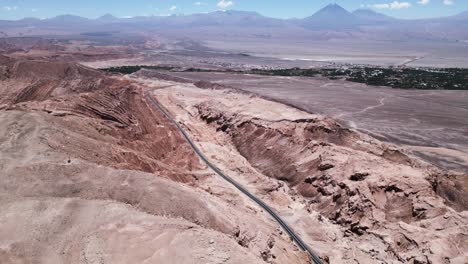 Aerial-Drone-Above-Road-to-San-Pedro-de-Atacama-Near-the-Moon-Valley-in-the-Atacama-Desert,-Northern-Chilean-Destination,-South-America