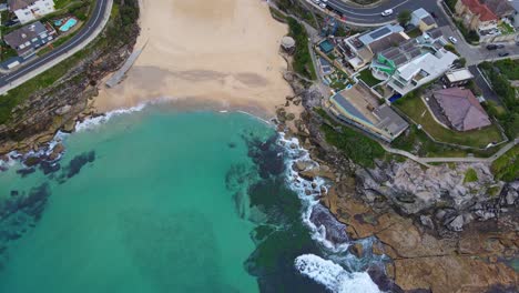 top view of tamarama beach and apartment buildings at the seafront in new south wales, australia