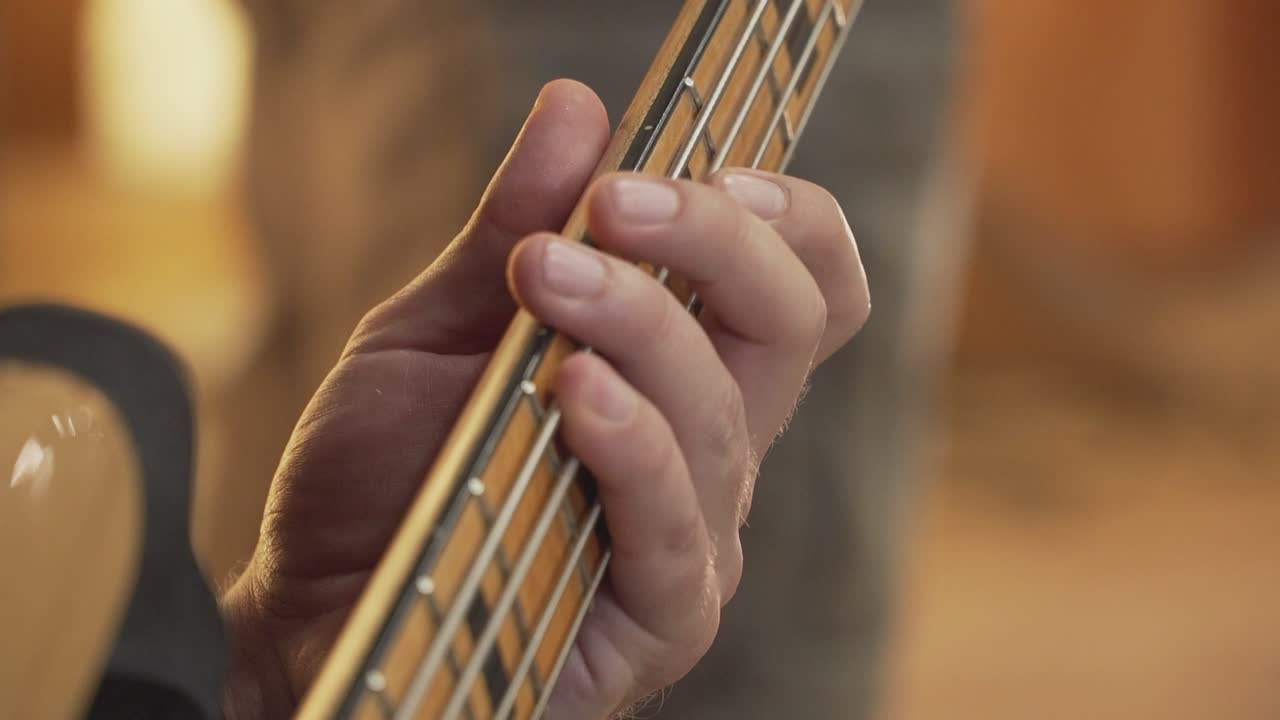 A man playing with his guitar.