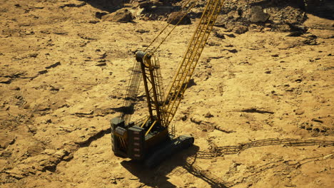 construction site with heavy machinery on rugged earthy terrain